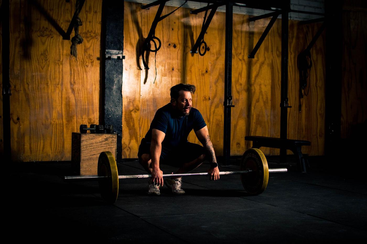 Athlete training with a barbell at Forma