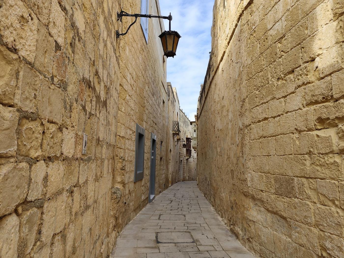 A quiet lamplit lane in Mdina