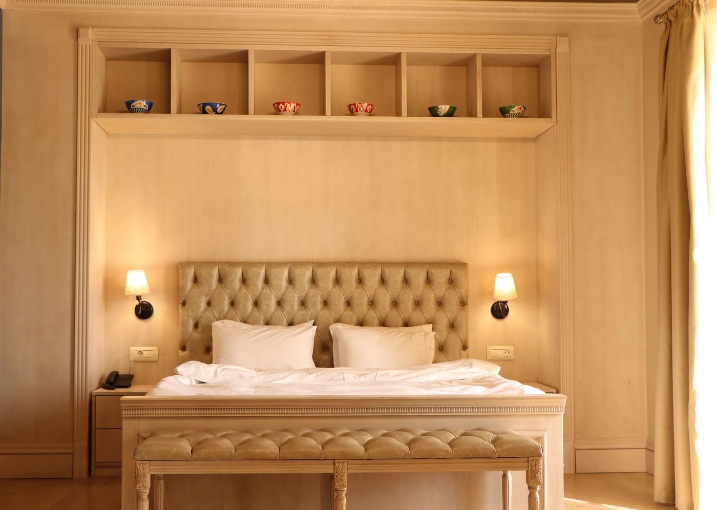 The Palazzo Room, a warm alcove bed in Maltese stone