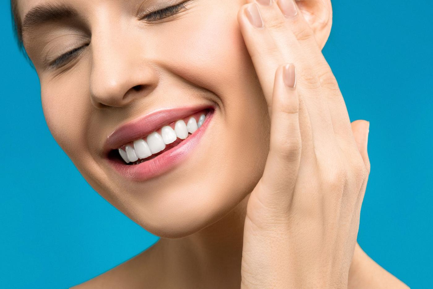 A patient smiling after a visit to VMS Dental